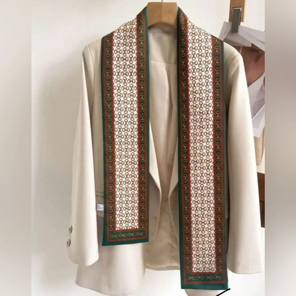 Elegant Cream Patterned Silk Scarf with Green Trim